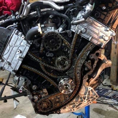 Engine tear-down showing chain guides and gears