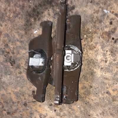 Worn brake pads before replacement